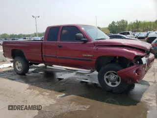 2000 Dodge 2500 with VIN 1B7KF2365YJ170069, listed as a Copart auction lot 64300184 with 372,690 mi miles and Salvage Title. Bid and sale history available at DreamBid. Image 4.