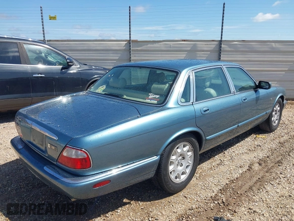 1998 Jaguar XJ with VIN SAJHX1241WC819418, listed as a IAAI auction lot 42456539 with 126,457 mi miles and . Bid and sale history available at DreamBid. Image 4.