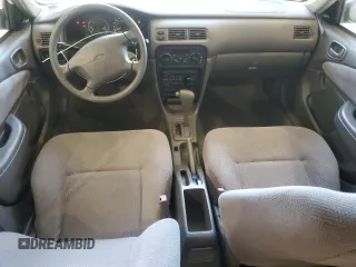 1999 Chevrolet Prizm z VIN 1Y1SK5281XZ429846, wystawiony jako Copart lot #56907955 z przebiegiem 90 581 mil mil oraz Szkoda całkowita • Salvage title. Historia ofert i sprzedaży dostępna na DreamBid. Obrazek 8.