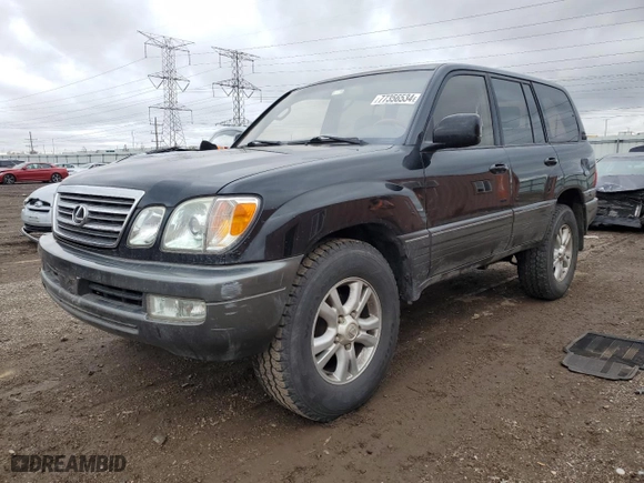 2003 Lexus LX 470 with VIN JTJHT00W333526380, listed as a Copart auction lot 77356534 with 151,636 mi miles and Salvage Title. Bid and sale history available at carsss.com. Image 1.