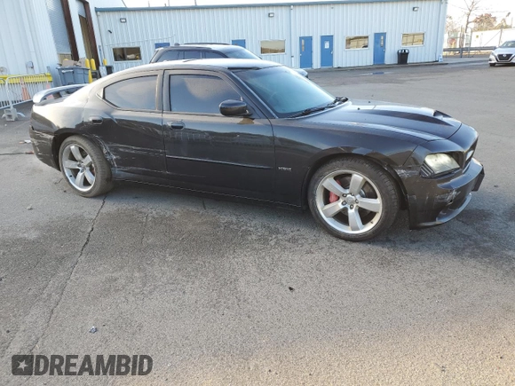 2006 Dodge Charger SRT-8 with VIN 2B3LA73W36H369475, listed as a Copart auction lot 43774705 with 130,495 mi miles and Salvage Title. Bid and sale history available at DreamBid. Image 4.
