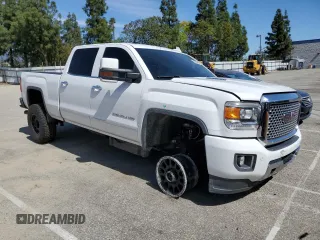 2015 GMC Sierra 2500HD available WiFi Denali with VIN 1GT120E80FF659215, listed as a Copart auction lot 48356455 with 134,796 mi miles and Salvage Title. Bid and sale history available at carsss.com. Image 4.