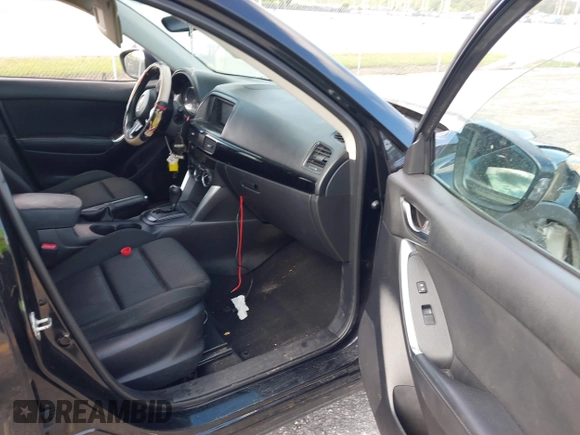 2014 Mazda CX-5 Touring with VIN JM3KE2CYXE0384987, listed as a IAAI auction lot 42052196 with 151,765 mi miles. Bid and sale history available at carsss.com. Image 5.