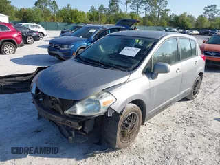 2012 Nissan Versa S with VIN 3N1BC1CP8CK242212, listed as a IAAI auction lot 42027327 with 117,118 mi miles. Bid and sale history available at carsss.com. Image 17.