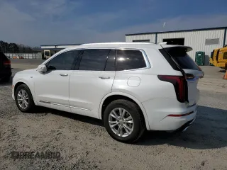 2024 Cadillac XT6 FWD Luxury z VIN 1GYKPAR47RZ705252, wystawiony jako Copart lot #49244015 z przebiegiem 26 838 mil mil oraz Szkody całkowita. Historia ofert i sprzedaży dostępna na DreamBid. Obrazek 2.