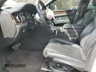 2020 Bentley Bentayga V8 z VIN SJAAM2ZV2LC028213, wystawiony jako Copart lot #52550255 z przebiegiem 50 238 mil mil oraz Szkody całkowita. Historia ofert i sprzedaży dostępna na DreamBid. Obrazek 7.