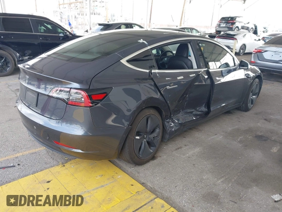 2020 Tesla Model 3 Standard Range Plus with VIN 5YJ3E1EA8LF743405, listed as a IAAI auction lot 41923592 with 81,901 mi miles. Bid and sale history available at carsss.com. Image 4.