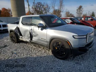 2023 Rivian R1T Adventure with VIN 7FCTGAAA2PN017170, listed as a Copart auction lot 77473014 with 28,821 mi miles and Salvage Title. Bid and sale history available at DreamBid. Image 4.