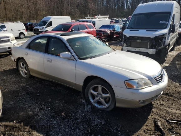 2002 Mazda Millenia S z VIN JM1TA222521733260, wystawiony jako Copart lot #49984755 z przebiegiem 140 212 mil mil oraz Szkoda całkowita • Salvage title. Historia ofert i sprzedaży dostępna na DreamBid. Obrazek 4.
