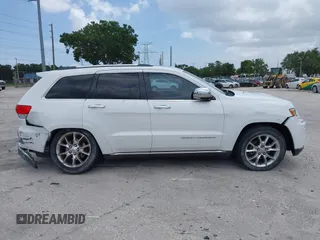 2014 Jeep Grand Cherokee Summit z VIN 1C4RJEJG1EC357948, wystawiony jako IAAI lot #42498652 z przebiegiem 213 715 mil mil oraz . Historia ofert i sprzedaży dostępna na DreamBid. Obrazek 13.