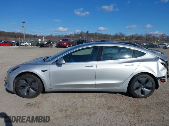 2018 Tesla Model 3 Long Range Battery with VIN 5YJ3E1EB9JF065057, listed as a IAAI auction lot 41863903 with 54,584 mi miles and . Bid and sale history available at DreamBid. Image 14.