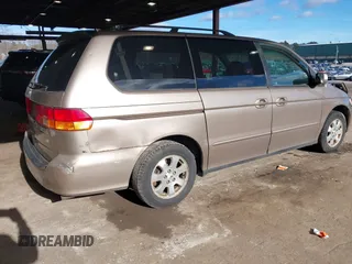 2004 Honda Odyssey EX-RES z VIN 5FNRL18874B127785, wystawiony jako IAAI lot #41141221 z przebiegiem 151 036 mil mil oraz . Historia ofert i sprzedaży dostępna na DreamBid. Obrazek 4.