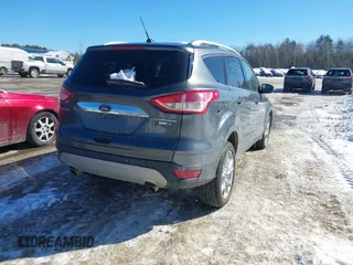 2015 Ford Escape Titanium with VIN 1FMCU9JX6FUB86304, listed as a IAAI auction lot 41595761 with 104,317 mi miles and . Bid and sale history available at DreamBid. Image 4.