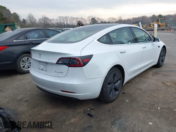 2018 Tesla Model 3 Long Range Battery with VIN 5YJ3E1EB4JF086012, listed as a IAAI auction lot 41683859 with 52,059 mi miles and . Bid and sale history available at DreamBid. Image 4.