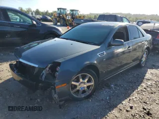 2009 Cadillac STS RWD z VIN 1G6DW67V390104597, wystawiony jako Copart lot #73794724 z przebiegiem Nie podano mil oraz Szkoda całkowita • Salvage title. Historia ofert i sprzedaży dostępna na DreamBid. Obrazek 1.