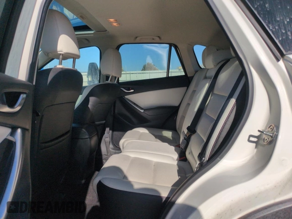 2016 Mazda CX-5 Grand Touring with VIN JM3KE4DY8G0671256, listed as a Copart auction lot 52920975 with 87,822 mi miles and Non Repairable. Bid and sale history available at carsss.com. Image 11.