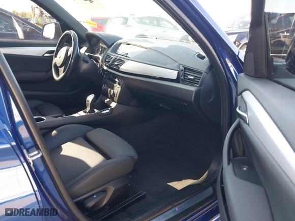 2015 BMW X1 xDrive28i with VIN WBAVL1C56FVY32753, listed as a IAAI auction lot 41759454 with 130,823 mi miles. Bid and sale history available at carsss.com. Image 5.