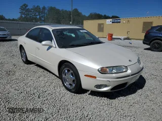 2003 Oldsmobile Aurora z VIN 1G3GS64CX34163493, wystawiony jako Copart lot #75863314 z przebiegiem 211 607 mil mil oraz Szkody całkowita. Historia ofert i sprzedaży dostępna na DreamBid. Obrazek 4.