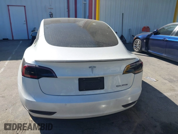 2020 Tesla Model 3 Standard Range Plus with VIN 5YJ3E1EA1LF659765, listed as a IAAI auction lot 41834411 with 42,433 mi miles and . Bid and sale history available at carsss.com. Image 16.