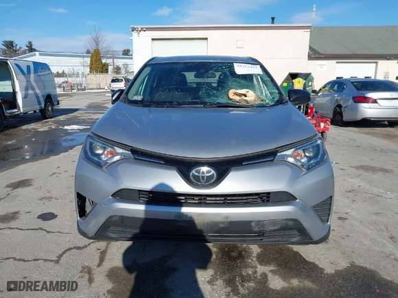 2018 Toyota RAV4 LE with VIN 2T3BFREV7JW728587, listed as a IAAI auction lot 41312419 with 103,134 mi miles. Bid and sale history available at carsss.com. Image 12.