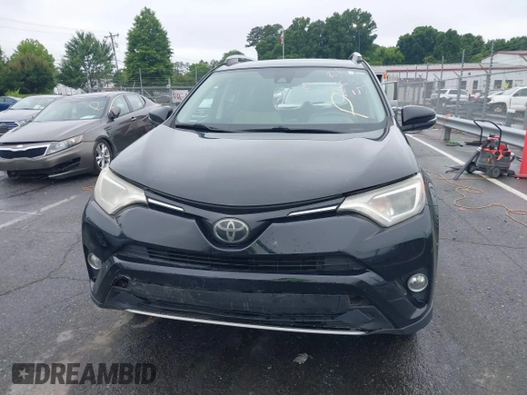 2018 Toyota RAV4 XLE with VIN 2T3WFREVXJW501296, listed as a IAAI auction lot 42358130 with 163,669 mi miles and . Bid and sale history available at DreamBid. Image 13.