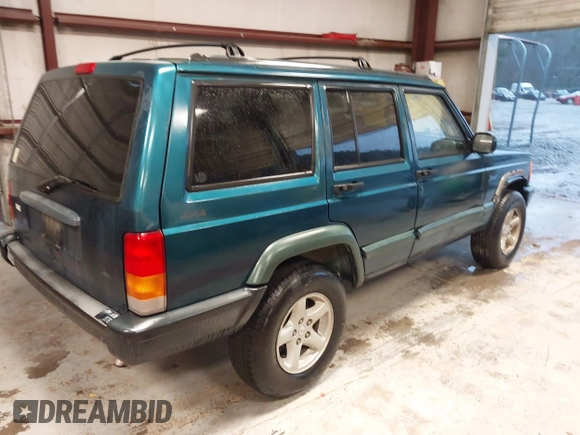 1997 Jeep Cherokee Sport with VIN 1J4FJ68S9VL594152, listed as a IAAI auction lot 41732573 with 65,316 mi miles. Bid and sale history available at carsss.com. Image 4.
