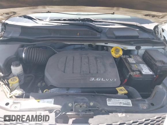 2014 Dodge Grand Caravan American Value with VIN 2C4RDGBG5ER187005, listed as a IAAI auction lot 42018333 with 216,149 mi miles and . Bid and sale history available at DreamBid. Image 10.