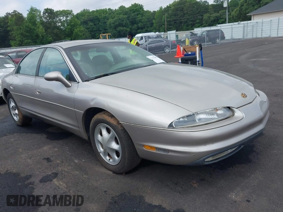 1997 Oldsmobile Aurora z VIN 1G3GR62CXV4121200, wystawiony jako IAAI lot #42277003 z przebiegiem 198 048 mil mil oraz . Historia ofert i sprzedaży dostępna na DreamBid. Obrazek 1.