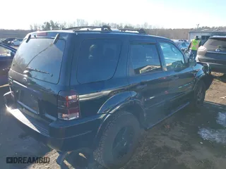 2002 Ford Escape Limited with VIN 1FMCU041X2KC74197, listed as a IAAI auction lot 41363369 with 153,704 mi miles. Bid and sale history available at carsss.com. Image 4.