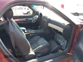 2004 Ford Thunderbird Deluxe with VIN 1FAHP60A34Y110824, listed as a IAAI auction lot 42155374 with 77,042 mi miles. Bid and sale history available at carsss.com. Image 5.