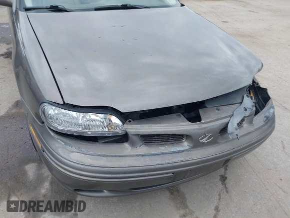1999 Oldsmobile Cutlass GLS z VIN 1G3NG52J1X6338096, wystawiony jako IAAI lot #42001327 z przebiegiem 77 452 mil mil oraz . Historia ofert i sprzedaży dostępna na DreamBid. Obrazek 18.