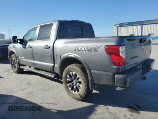 2017 Nissan Titan Platinum Reserve z VIN 1N6AA1E53HN543012, wystawiony jako Copart lot #39144854 z przebiegiem 83 008 mil mil oraz Szkoda całkowita • Salvage title. Historia ofert i sprzedaży dostępna na DreamBid. Obrazek 2.