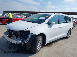 2022 Chrysler Pacifica Touring L with VIN 2C4RC1BG8NR197706, listed as a IAAI auction lot 42414290 with 56,972 mi miles and . Bid and sale history available at DreamBid. Image 2.