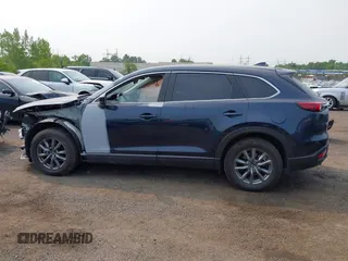 2023 Mazda CX-9 Touring with VIN JM3TCBCY6P0642838, listed as a IAAI auction lot 42407123 with 15,181 mi miles and . Bid and sale history available at DreamBid. Image 14.