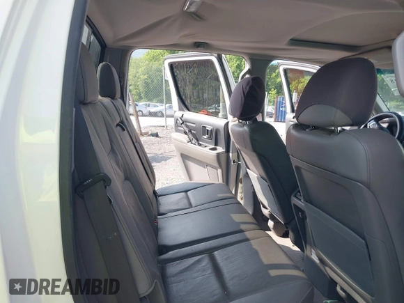 2010 Honda Ridgeline RTL with VIN 5FPYK1F58AB012526, listed as a IAAI auction lot 42421618 with 258,727 mi miles and . Bid and sale history available at DreamBid. Image 8.