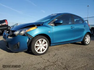 2012 Mazda Mazda2 Sport with VIN JM1DE1KY2C0137389, listed as a Copart auction lot 51877425 with 56,558 mi miles and Salvage Title. Bid and sale history available at carsss.com. Image 1.