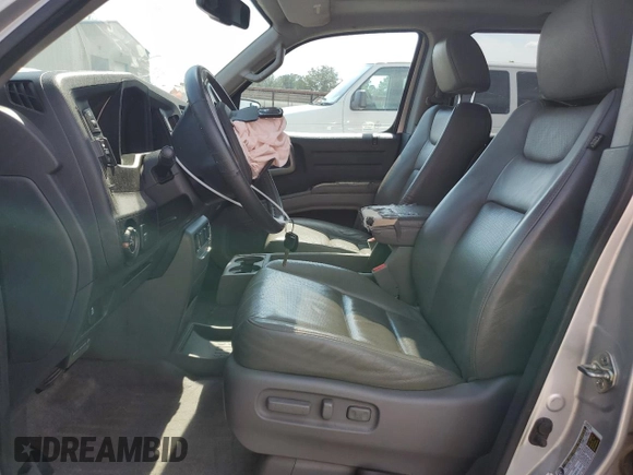 2014 Honda Ridgeline RTL with VIN 5FPYK1F57EB002835, listed as a Copart auction lot 54748905 with 111,253 mi miles and Salvage title. Bid and sale history available at DreamBid. Image 7.
