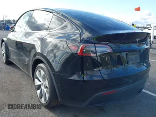 2022 Tesla Model Y Long Range with VIN 7SAYGAEE4NF522330, listed as a IAAI auction lot 42046691 with 59,980 mi miles and . Bid and sale history available at carsss.com. Image 3.