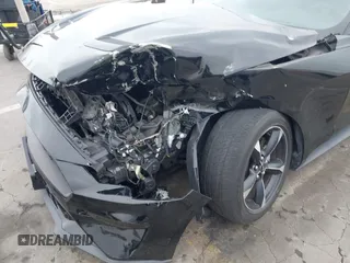 2021 Ford Mustang EcoBoost z VIN 1FA6P8TH7M5115490, wystawiony jako IAAI lot #42428724 z przebiegiem 47 417 mil mil oraz . Historia ofert i sprzedaży dostępna na DreamBid. Obrazek 6.