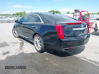 2014 Cadillac XTS Luxury z VIN 2G61N5S30E9170305, wystawiony jako IAAI lot #42223317 z przebiegiem 103 692 mil mil oraz . Historia ofert i sprzedaży dostępna na DreamBid. Obrazek 3.