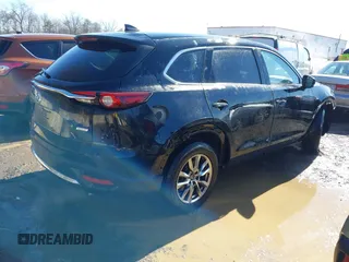 2018 Mazda CX-9 Touring with VIN JM3TCBCY3J0228231, listed as a IAAI auction lot 41596236 with 133,481 mi miles and . Bid and sale history available at DreamBid. Image 4.