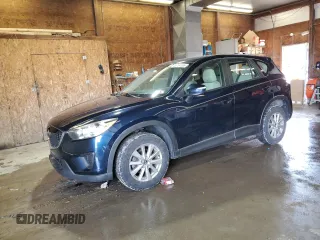 2015 Mazda CX-5 Sport z VIN JM3KE2BE9F0553339, wystawiony jako Copart lot #56754265 z przebiegiem 115 850 mil mil oraz Szkoda całkowita • Salvage title. Historia ofert i sprzedaży dostępna na DreamBid. Obrazek 1.