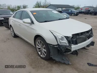 2013 Cadillac XTS Luxury z VIN 2G61P5S32D9131949, wystawiony jako IAAI lot #42144719 z przebiegiem 68 811 mil mil oraz . Historia ofert i sprzedaży dostępna na DreamBid. Obrazek 1.
