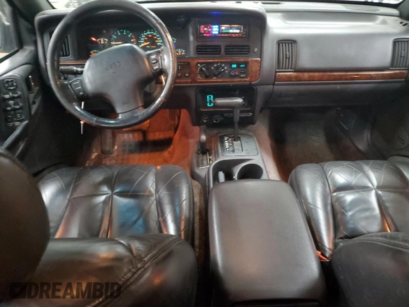 1996 Jeep Grand Cherokee Limited z VIN 1J4GZ78S5TC210710, wystawiony jako Copart lot #81307904 z przebiegiem 285 169 mil mil oraz Szkoda całkowita • Salvage title. Historia ofert i sprzedaży dostępna na DreamBid. Obrazek 8.