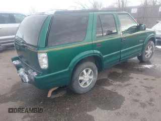 1999 Oldsmobile Bravada z VIN 1GHDT13W7X2711363, wystawiony jako IAAI lot #41294782 z przebiegiem 198 508 mil mil oraz . Historia ofert i sprzedaży dostępna na DreamBid. Obrazek 4.