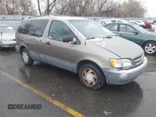 1999 Toyota Sienna LE with VIN 4T3ZF13C9XU164032, listed as a IAAI auction lot 41916673 with 296,628 mi miles and . Bid and sale history available at DreamBid. Image 1.