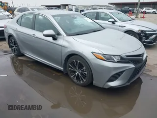 2019 Toyota Camry LE z VIN 4T1B11HK5KU207427, wystawiony jako IAAI lot #41908705 z przebiegiem 49 515 mil mil oraz . Historia ofert i sprzedaży dostępna na DreamBid. Obrazek 1.