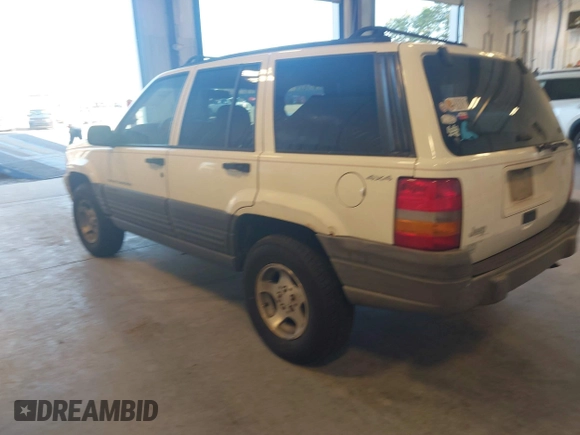 1997 Jeep Grand Cherokee Laredo with VIN 1J4GZ58SXVC552435, listed as a IAAI auction lot 41977888 with 143,832 mi miles. Bid and sale history available at carsss.com. Image 3.