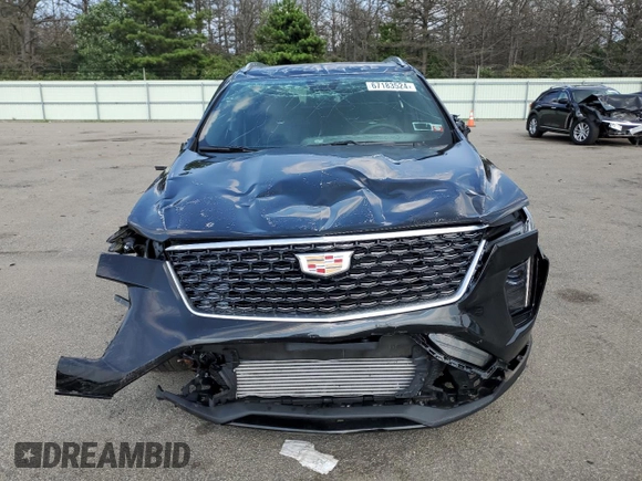2024 Cadillac XT4 AWD Premium Luxury with VIN 1GYFZDR49RF112460, listed as a Copart auction lot 67183524 with 12,396 mi miles and Salvage title. Bid and sale history available at DreamBid. Image 5.