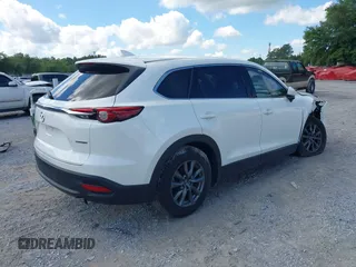 2022 Mazda CX-9 Touring z VIN JM3TCBCY7N0600787, wystawiony jako IAAI lot #42240512 z przebiegiem 27 927 mil mil oraz . Historia ofert i sprzedaży dostępna na DreamBid. Obrazek 4.